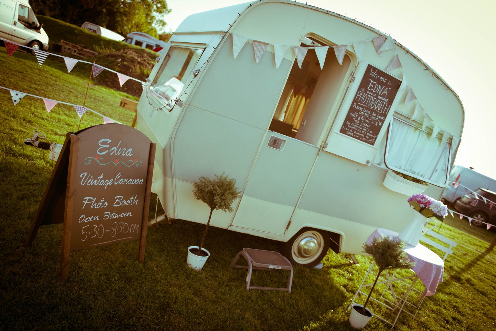 Edna parked out on the grass with her bunting up and her sandwich board out front